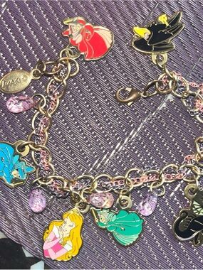 Disney Gold-Tone Charm Bracelet with Pink, Teal, Black and Yellow Accents
